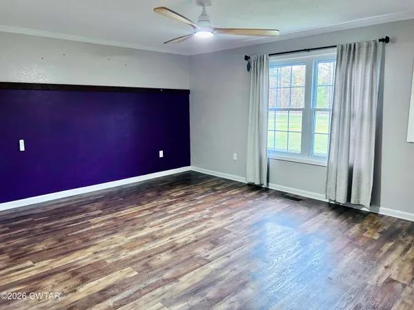 a sitting area with lots of furniture and a rug