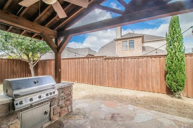 a view of outdoor space with wooden floor