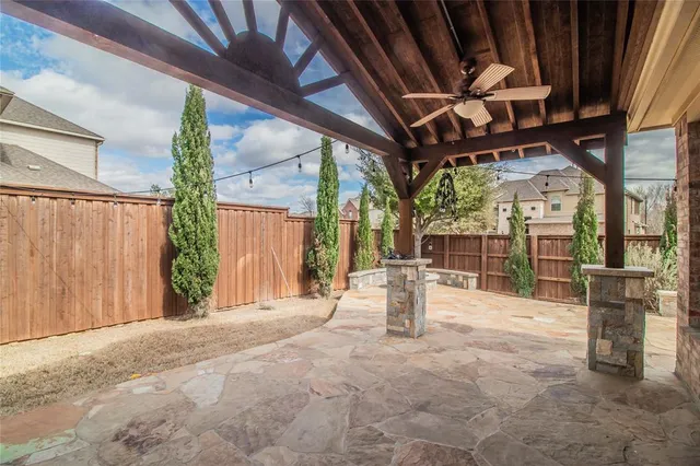 a view of a chairs with wooden fence