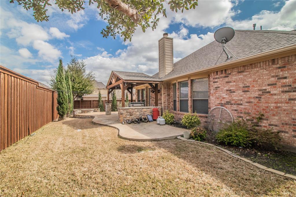 4647 Phillip Drive Plano, TX 75024 - Photo 32 of 38 a front view of a house with natural light