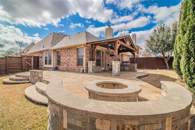 a view of a house with swimming pool and furniture