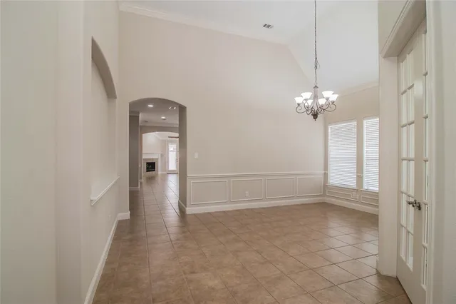 a view of a hallway with a chandelier