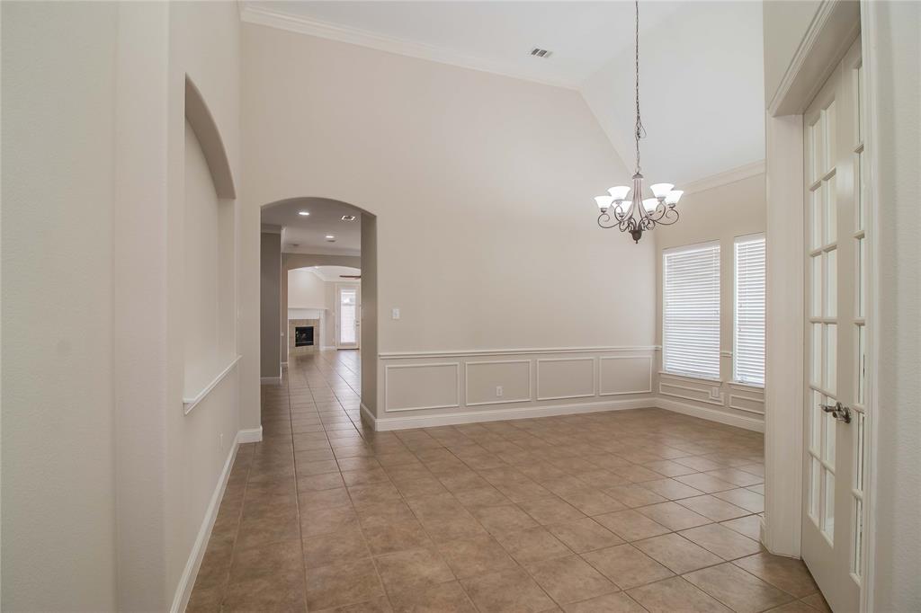 4647 Phillip Drive Plano, TX 75024 - Photo 4 of 38 a view of a hallway with a chandelier