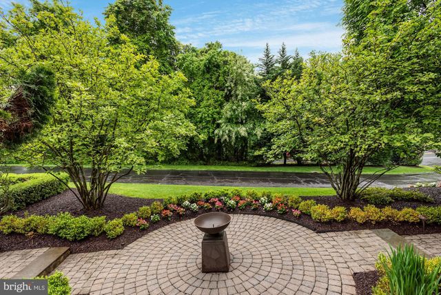 a view of a chair and fire pit in the garden