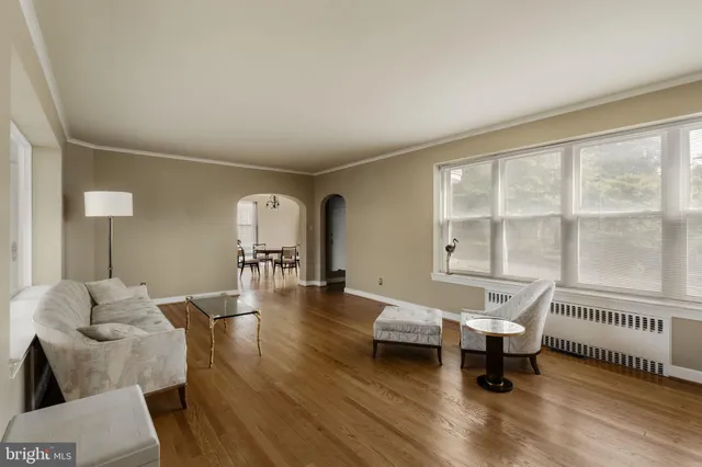 a bedroom with a bed and a chair