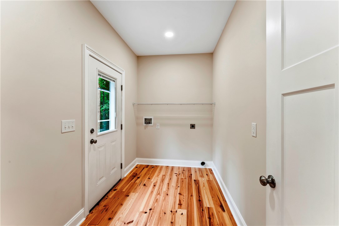 110 Gabriel Way Pickens, SC 29671 - Photo 11 of 48 A dedicated laundry space offers a versatile layout and bright wooden flooring for everyday chores.