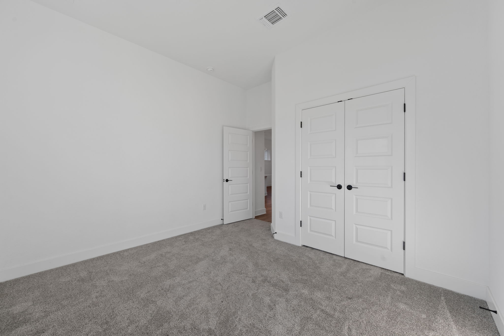 5902 Rangeland Road Austin, TX 78747 - Photo 15 of 35 Unfurnished bedroom featuring carpet floors and a closet