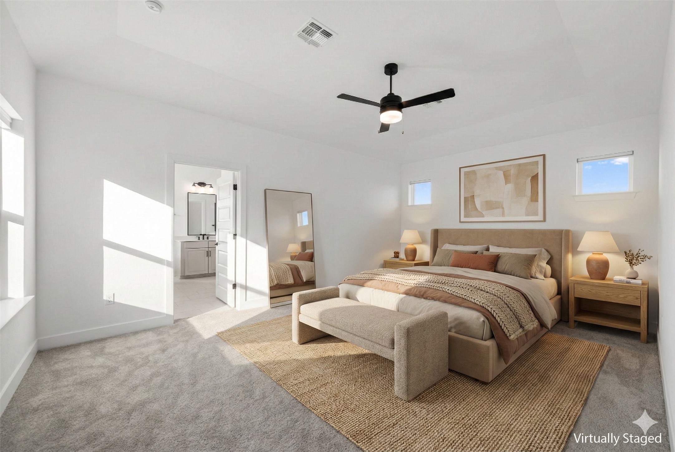 5902 Rangeland Road Austin, TX 78747 - Photo 19 of 35 Bedroom with light carpet, multiple windows, a ceiling fan, and ensuite bathroom