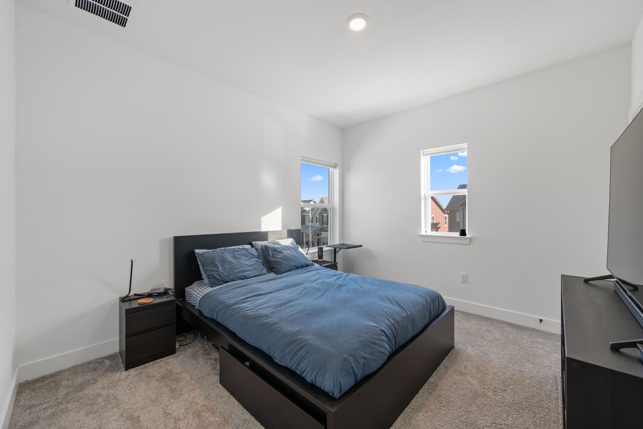 5902 Rangeland Road Austin, TX 78747 - Photo 25 of 35 Bedroom with baseboards and light carpet