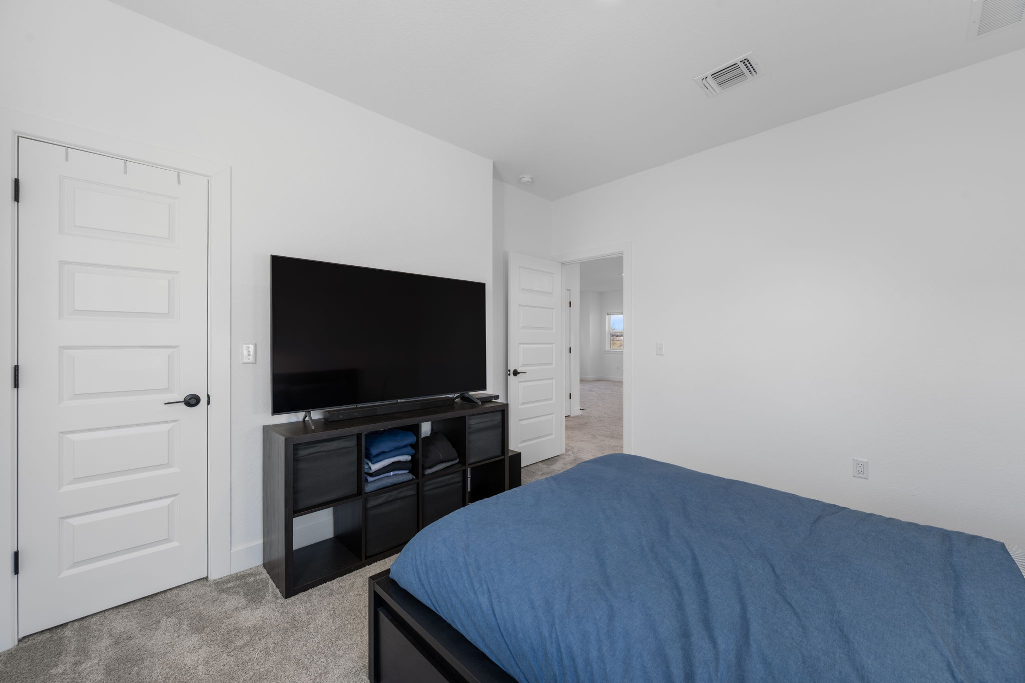 5902 Rangeland Road Austin, TX 78747 - Photo 26 of 35 Bedroom with light carpet