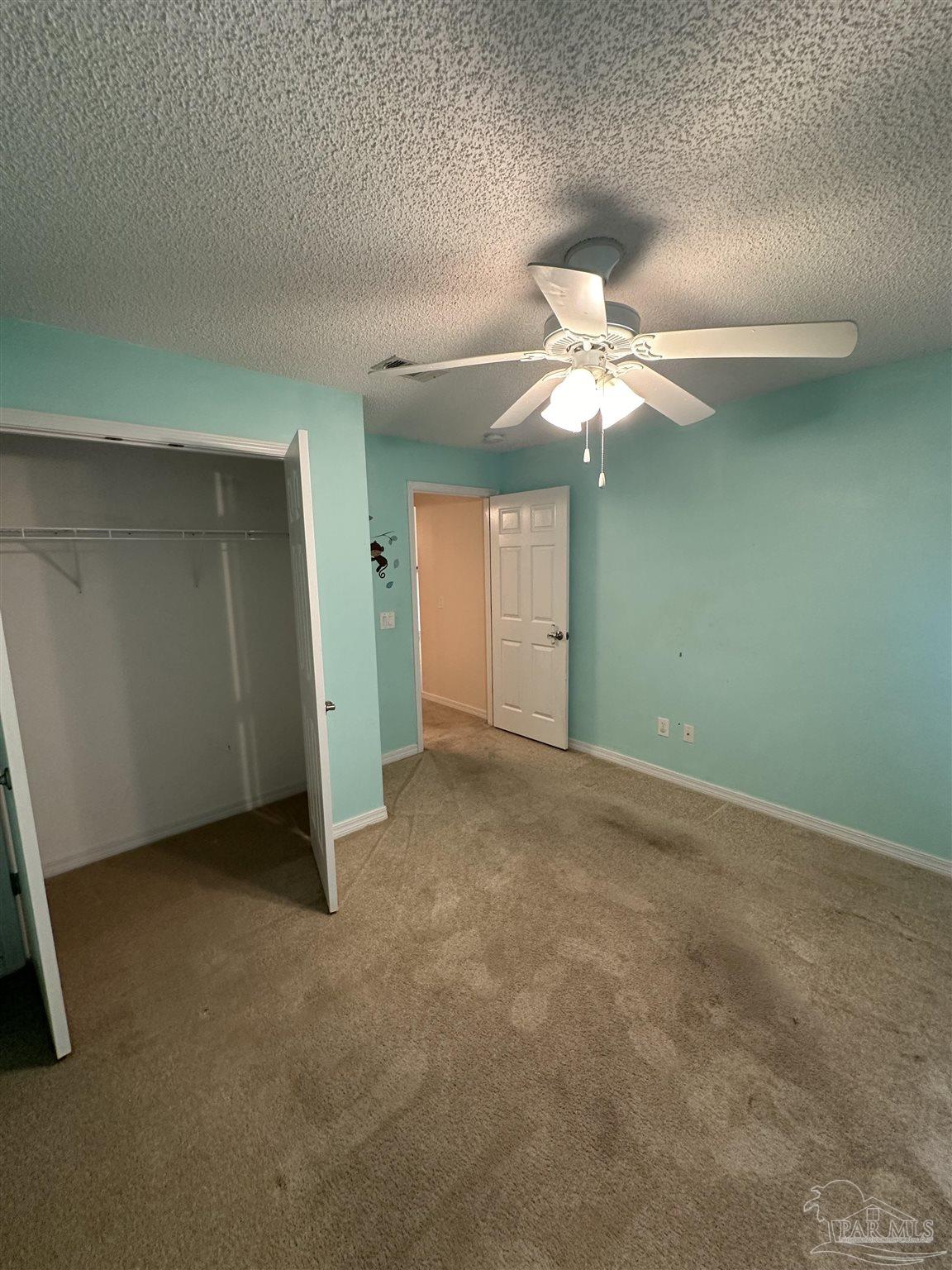 4968 Makenna Circle Pace, FL 32571 - Photo 18 of 21 an empty room with fan and fan