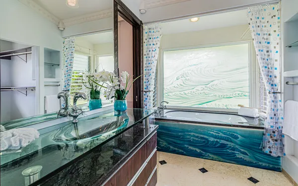 a bathroom with a bathtub and a shower