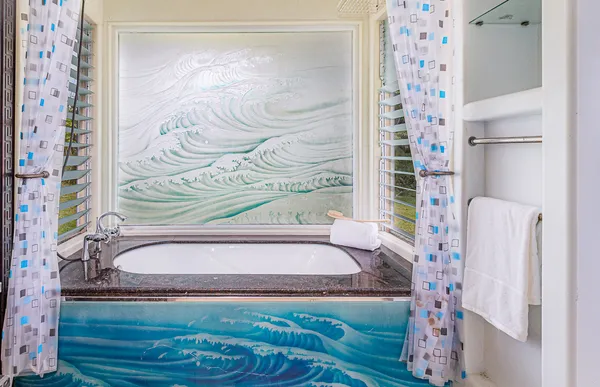 a bathroom with a bathtub and a sink
