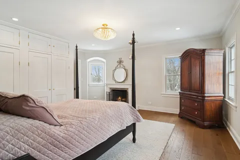 a bedroom with a bed dresser and a window