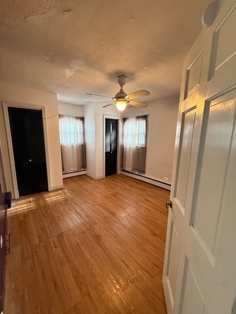 1018 West Plainfield Road Countryside, IL 60525 - Photo 2 of 17 a view of an empty room with wooden floor and a window