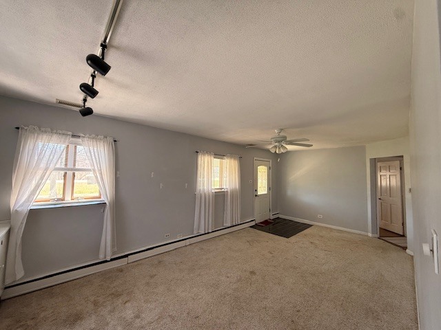 1018 West Plainfield Road Countryside, IL 60525 - Photo 4 of 17 an empty room with windows and fan