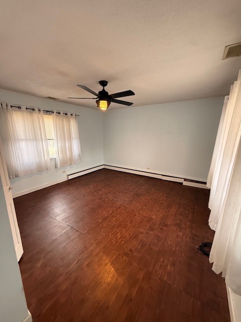 1018 West Plainfield Road Countryside, IL 60525 - Photo 7 of 17 an empty room with wooden floor and windows