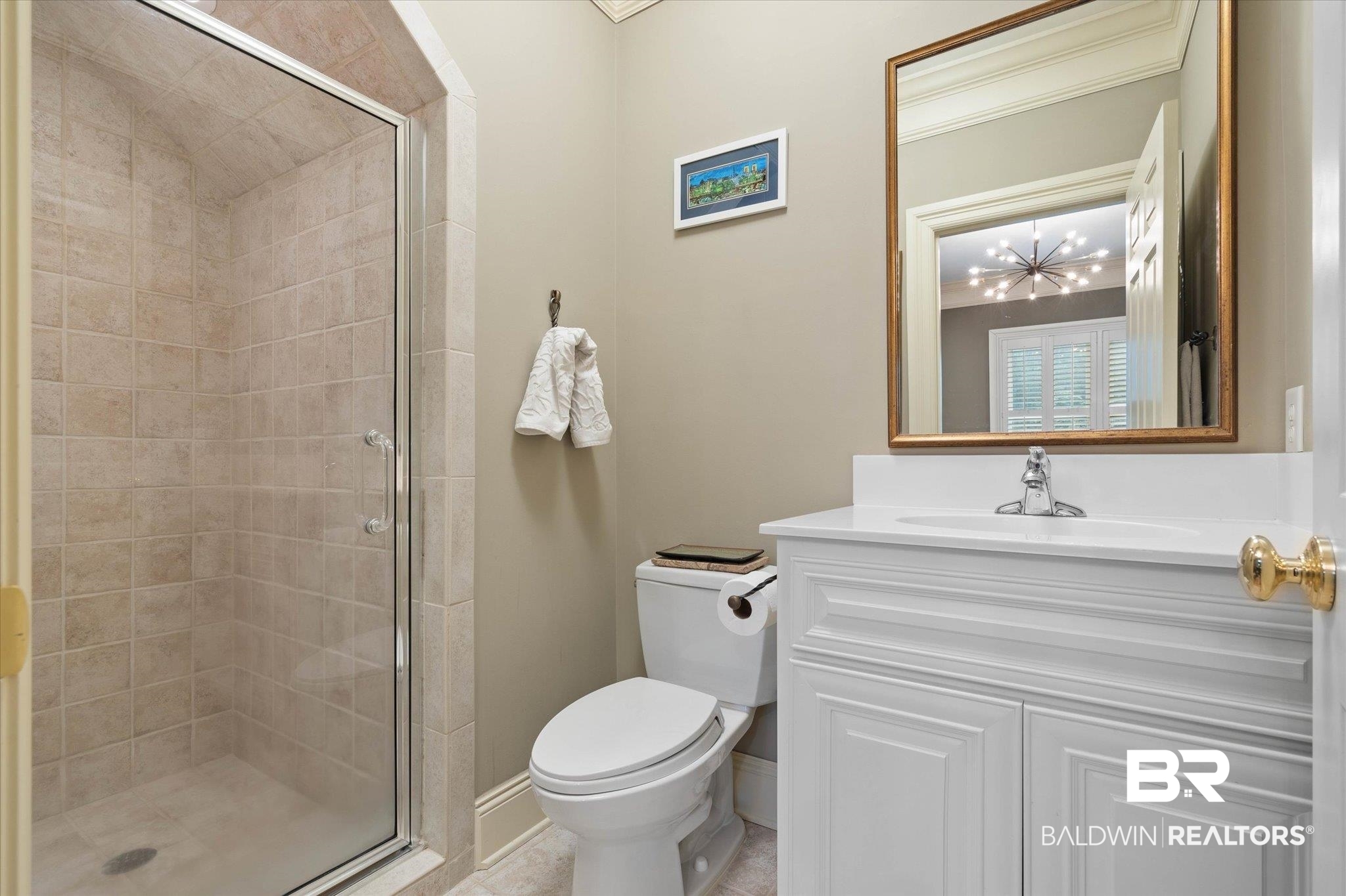 4008 McGregor Oaks Mobile, AL 36608 - Photo 34 of 50 Full bath with a stall shower, vanity, a chandelier, and ornamental molding