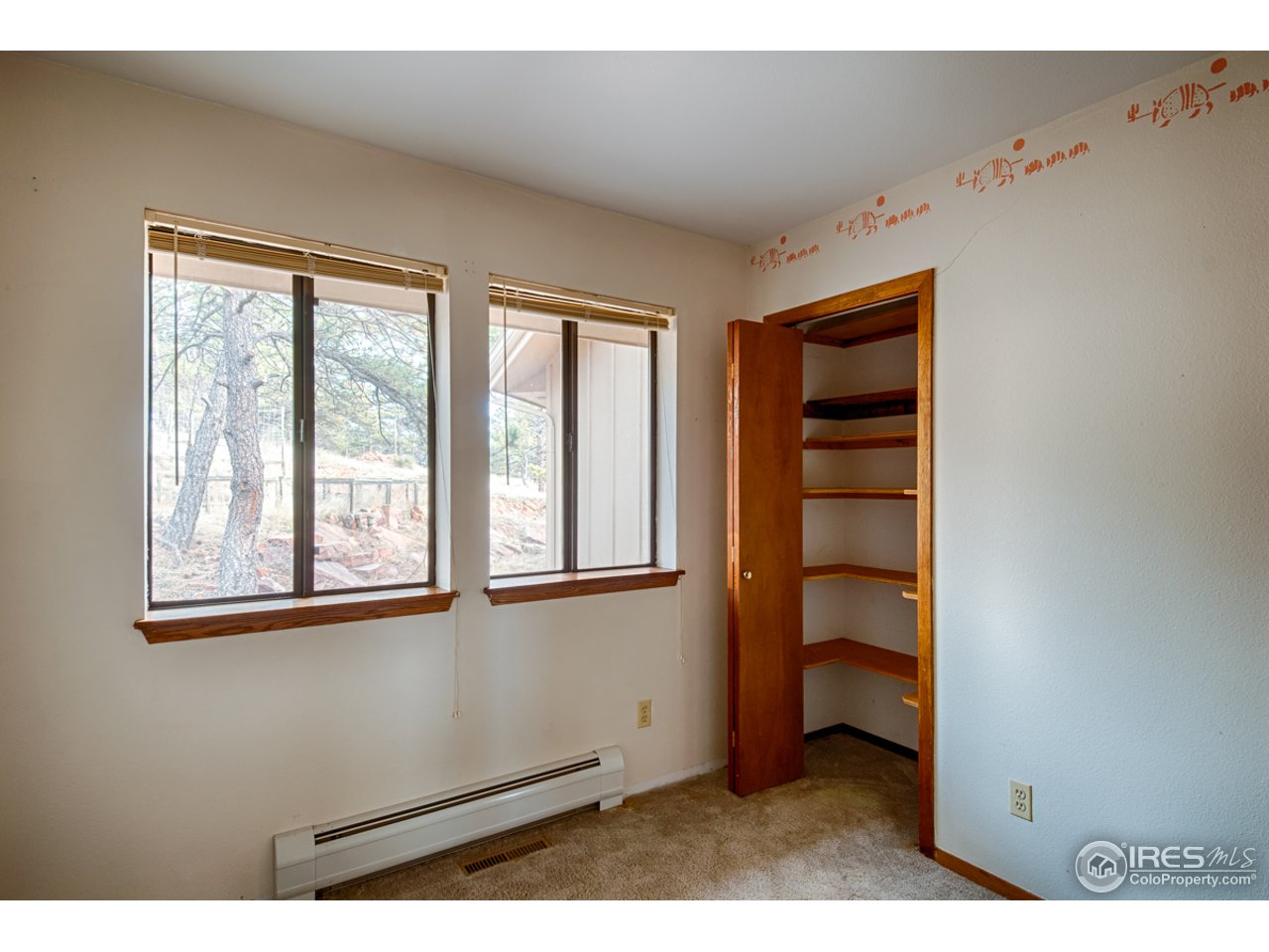 601 Eagle Ridge Road Longmont, CO 80503 - Photo 25 of 40 a view of a bedroom with a window