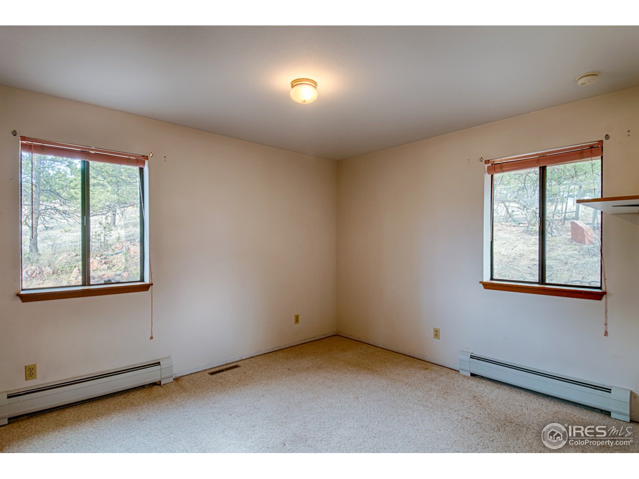 601 Eagle Ridge Road Longmont, CO 80503 - Photo 26 of 40 an empty room with windows