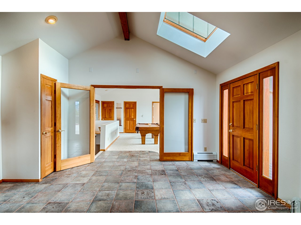 601 Eagle Ridge Road Longmont, CO 80503 - Photo 6 of 40 a view of an empty room with glass door