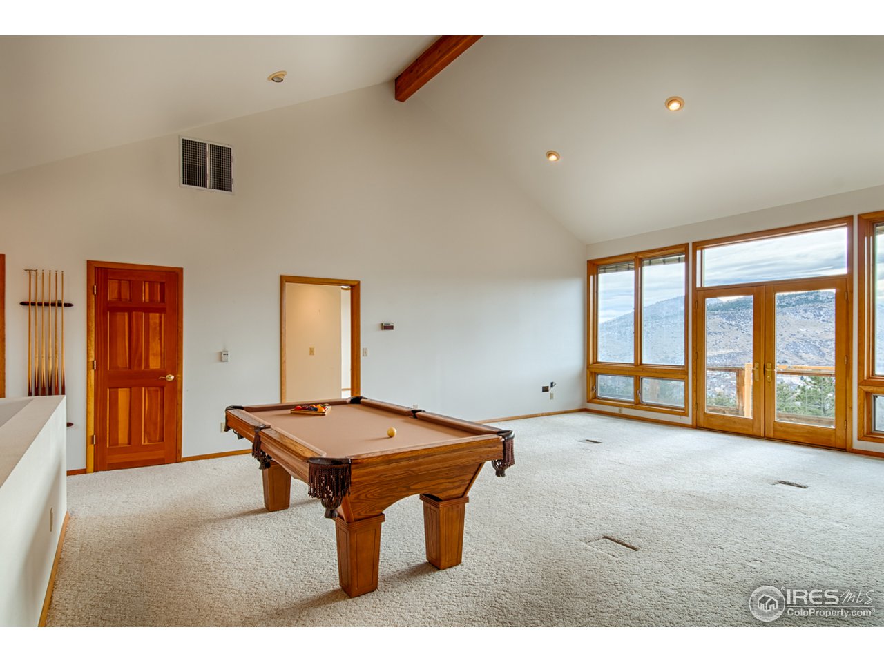 601 Eagle Ridge Road Longmont, CO 80503 - Photo 7 of 40 a room with pool table and windows