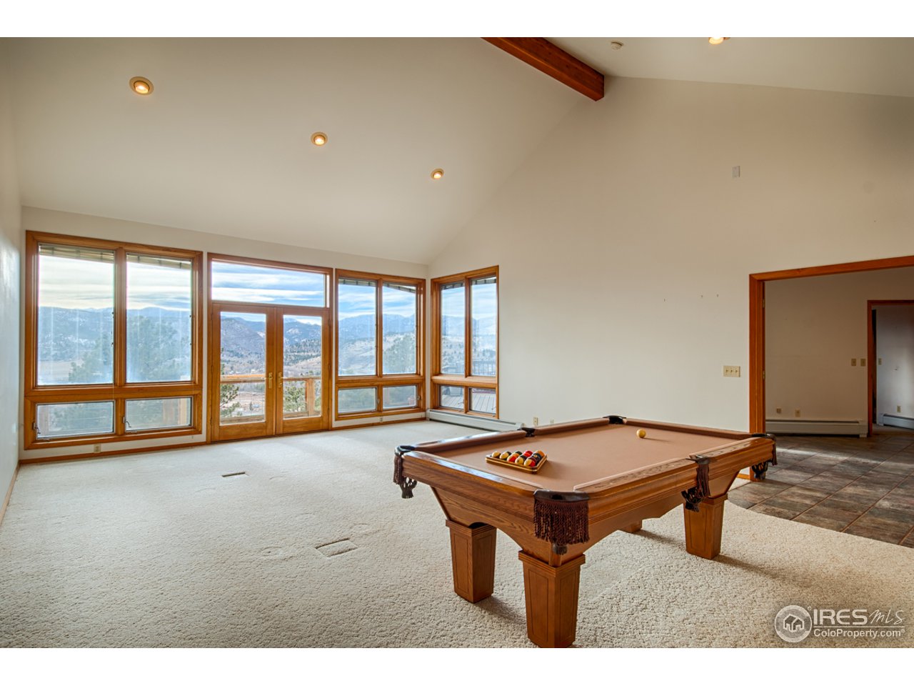601 Eagle Ridge Road Longmont, CO 80503 - Photo 8 of 40 a room with furniture pool table and windows
