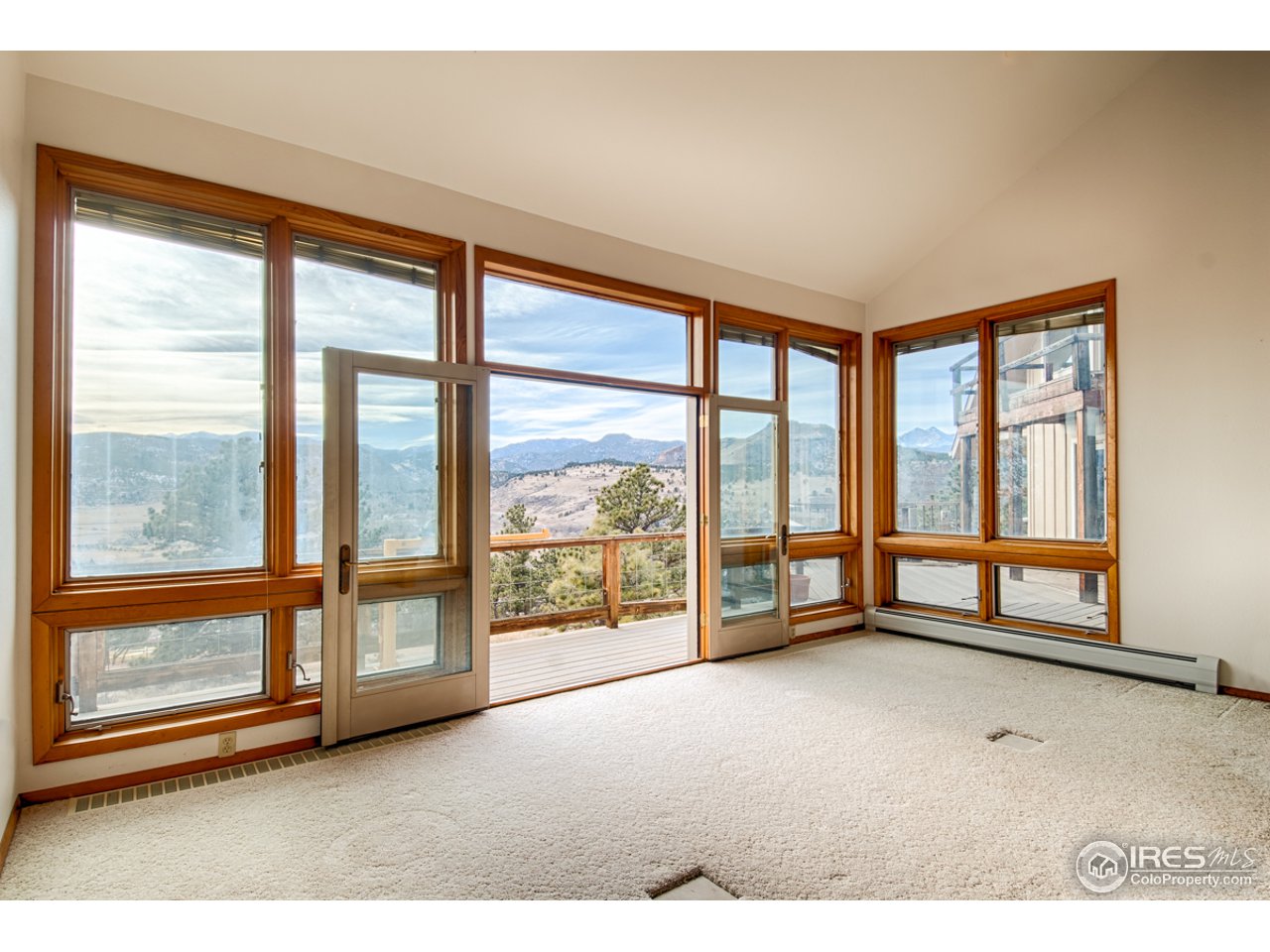 601 Eagle Ridge Road Longmont, CO 80503 - Photo 9 of 40 a view of an empty room with a large window
