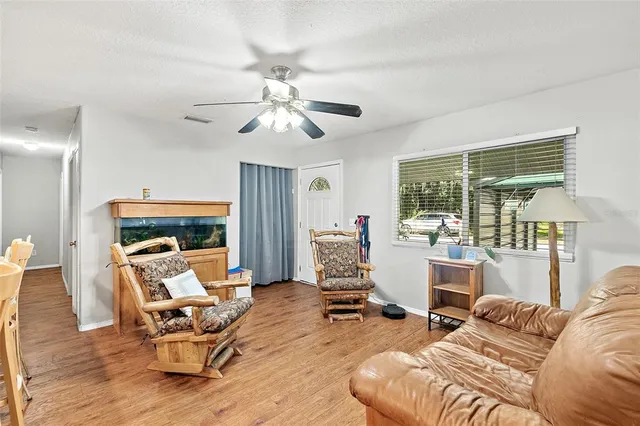 a living room with furniture or outdoor view and a large window