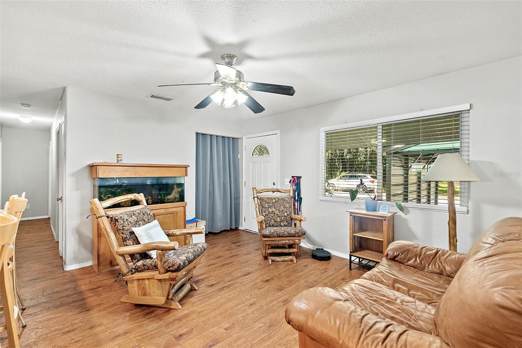 405 North Cherry Street Bunnell, FL 32110 - Photo 14 of 52 a living room with furniture or outdoor view and a large window