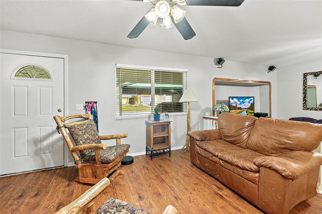 405 North Cherry Street Bunnell, FL 32110 - Photo 16 of 52 a living room with furniture and a large window