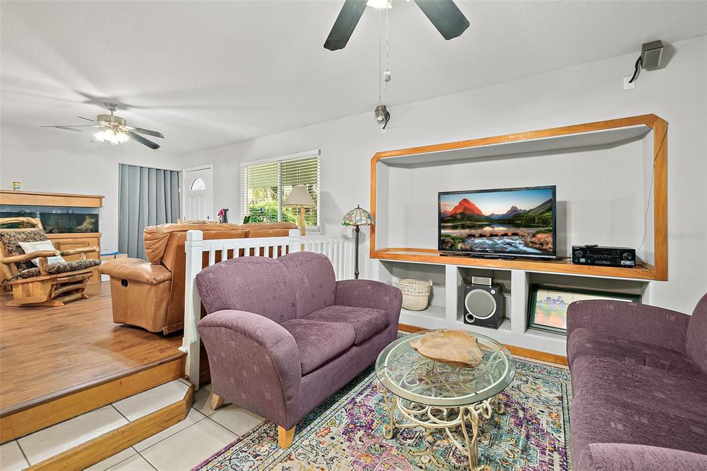 405 North Cherry Street Bunnell, FL 32110 - Photo 19 of 52 a living room with furniture a rug and a flat screen tv