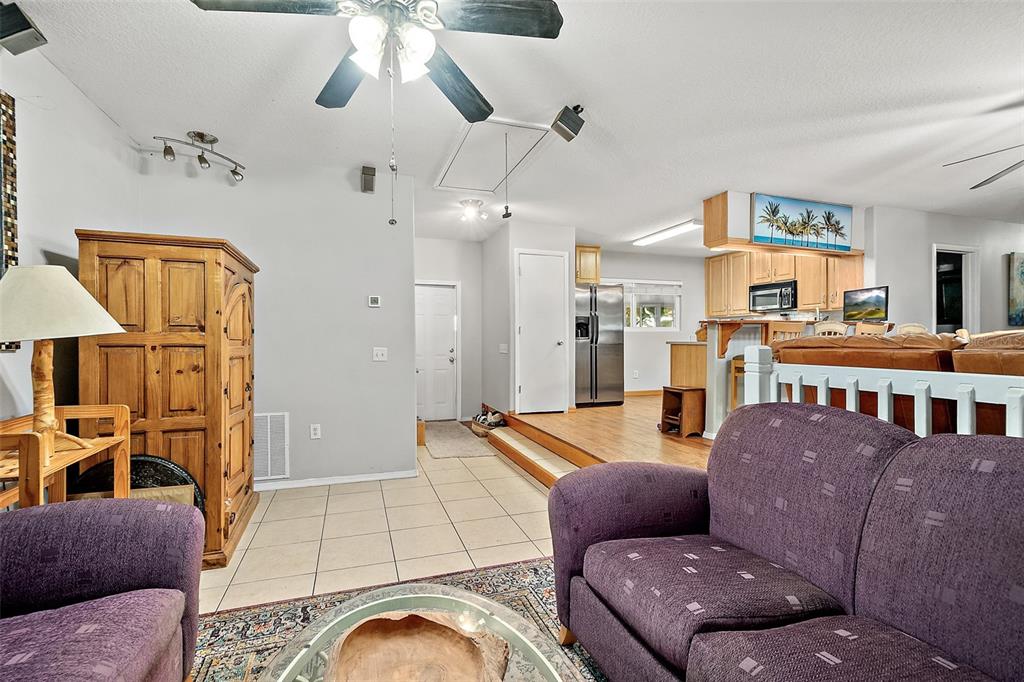 405 North Cherry Street Bunnell, FL 32110 - Photo 24 of 52 a living room with furniture and a chandelier