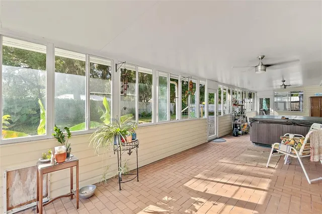 a room with lots of furniture and large windows