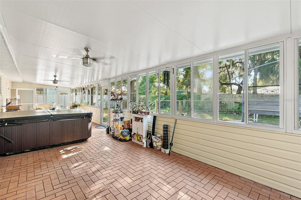 405 North Cherry Street Bunnell, FL 32110 - Photo 26 of 52 a room with lots of furniture and large windows