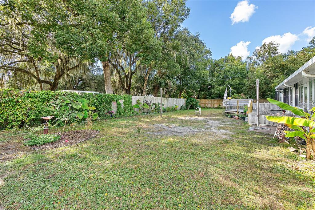405 North Cherry Street Bunnell, FL 32110 - Photo 28 of 52 a view of a park with swings and slides