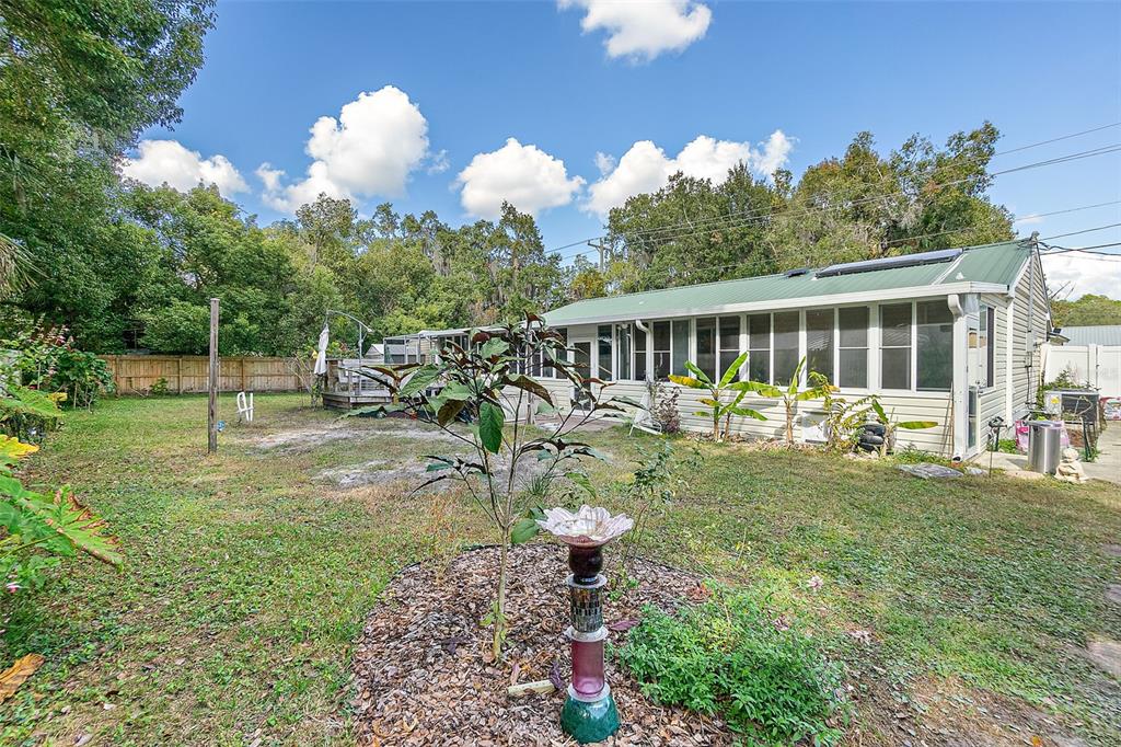 405 North Cherry Street Bunnell, FL 32110 - Photo 29 of 52 a view of a house with backyard and sitting area