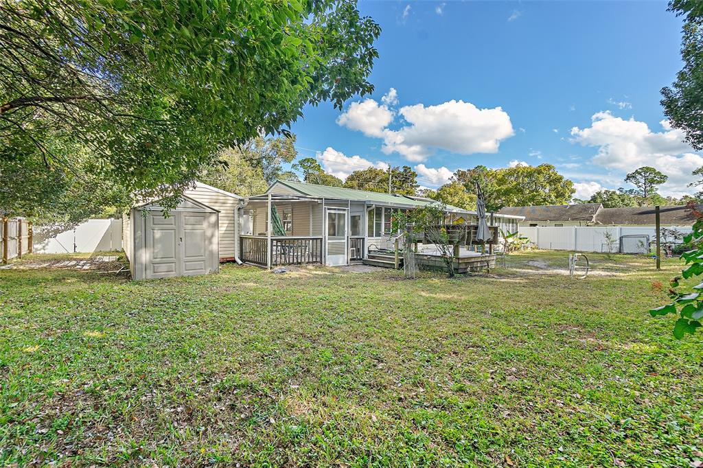 405 North Cherry Street Bunnell, FL 32110 - Photo 31 of 52 a view of a house with a yard