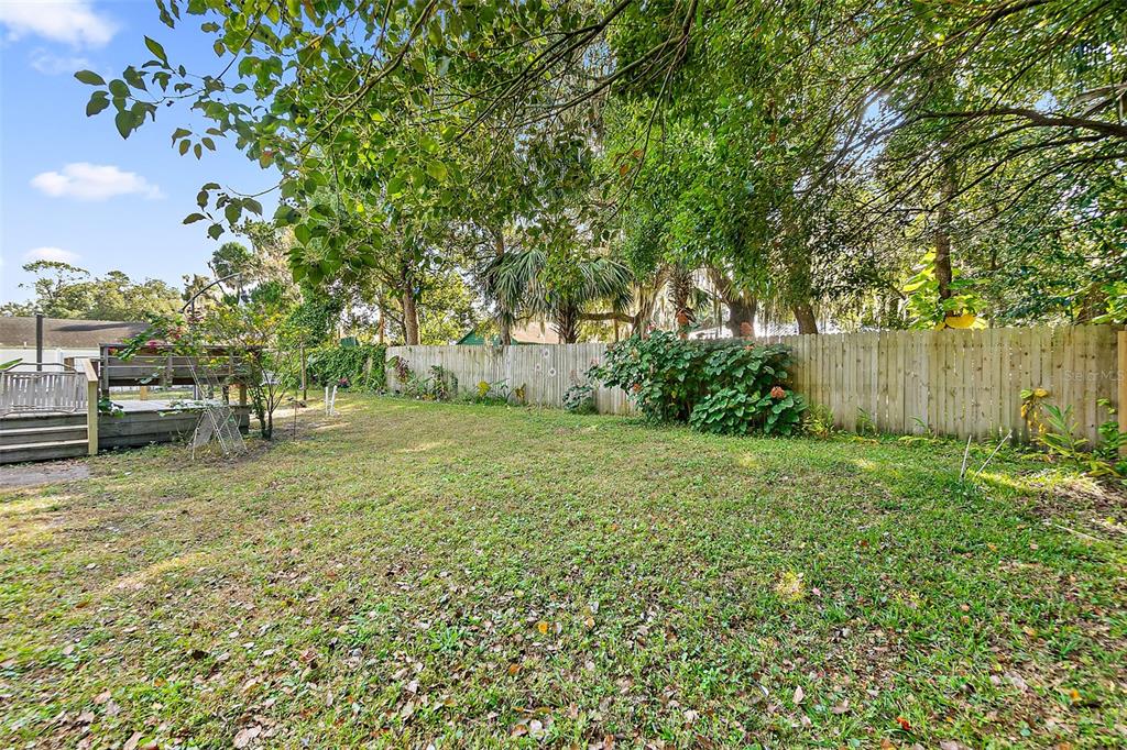 405 North Cherry Street Bunnell, FL 32110 - Photo 32 of 52 a view of backyard with green space