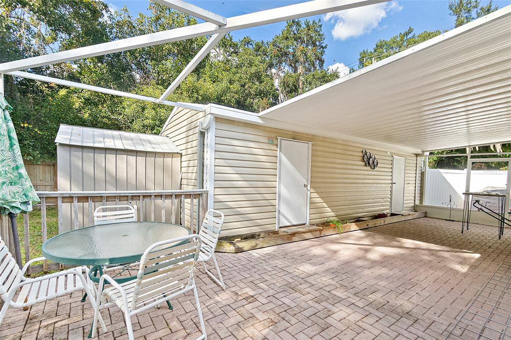 405 North Cherry Street Bunnell, FL 32110 - Photo 34 of 52 a balcony with table and chairs