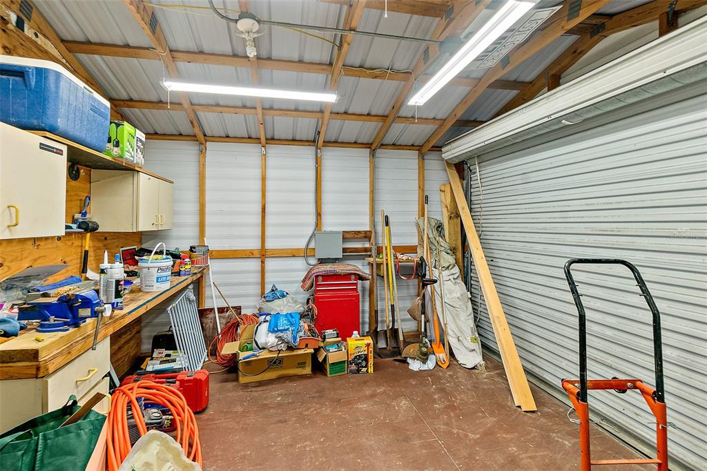 405 North Cherry Street Bunnell, FL 32110 - Photo 37 of 52 a utility room with dryer and bicycles
