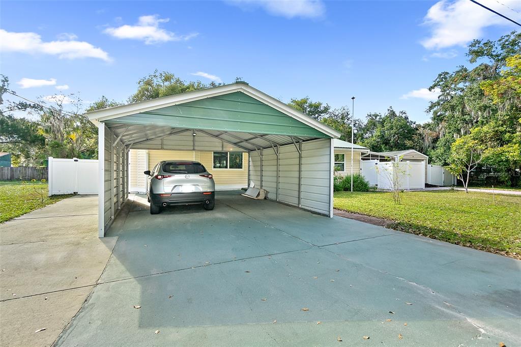 405 North Cherry Street Bunnell, FL 32110 - Photo 40 of 52 a view of a house with a yard