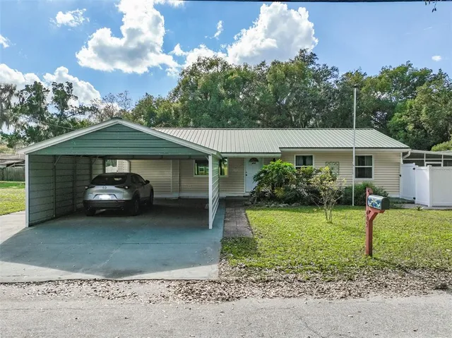 a backyard of a house with plants