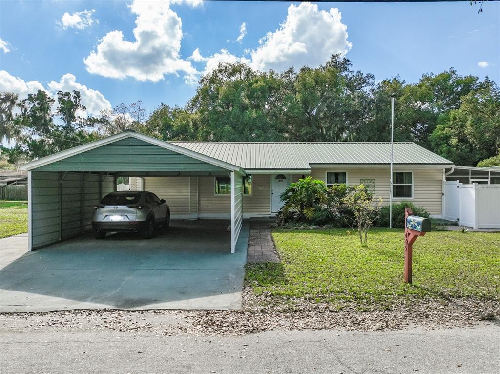 405 North Cherry Street Bunnell, FL 32110 - Photo 42 of 52 a front view of a house with garden