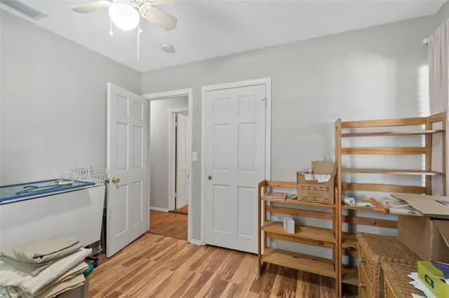a view of room with a ceiling fan
