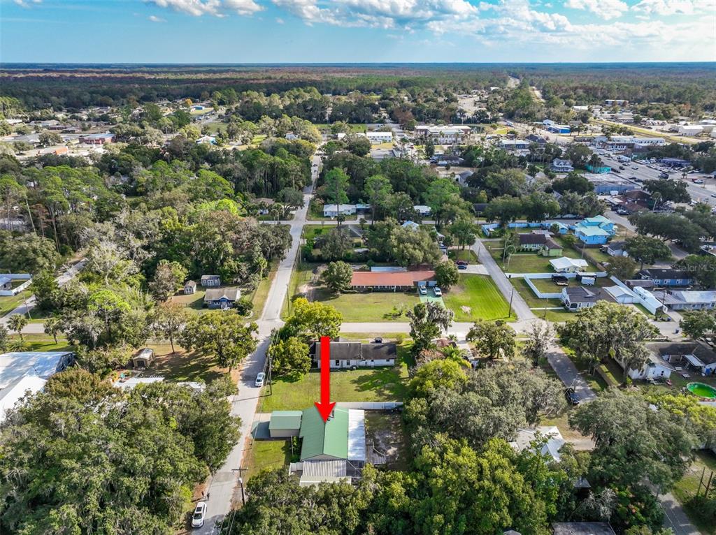 405 North Cherry Street Bunnell, FL 32110 - Photo 52 of 52 an aerial view of a houses with a swimming pool
