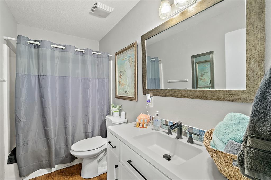 405 North Cherry Street Bunnell, FL 32110 - Photo 6 of 52 a bathroom with a sink toilet and shower