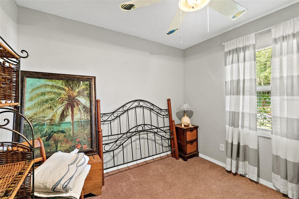 405 North Cherry Street Bunnell, FL 32110 - Photo 7 of 52 a bedroom with furniture and a window