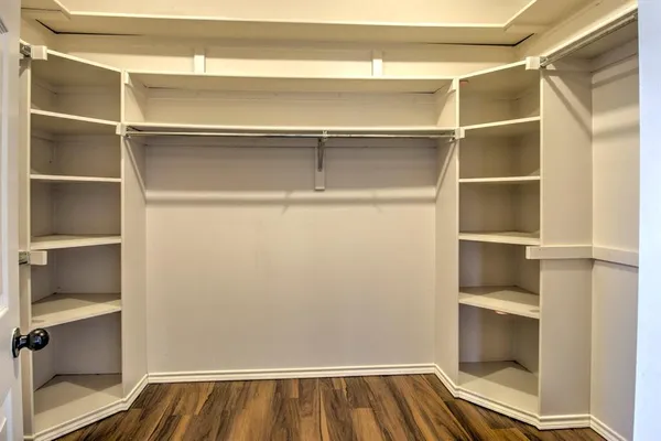 a view of an empty walk in closet