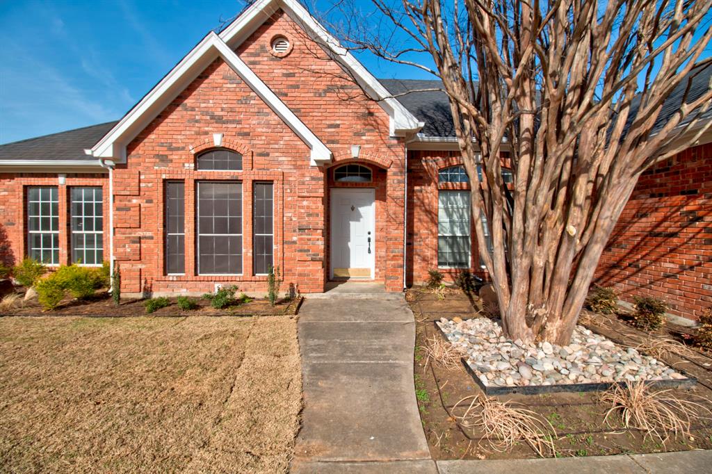1400 North St Charles Street Pilot Point, TX 76258 - Photo 2 of 30 a front view of a house with a yard